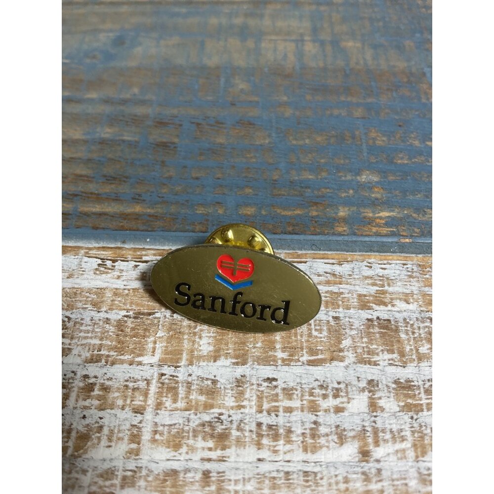 Sanford Gold-Tone Oval Enamel Lapel Pin With Heart Logo & Clutch Back